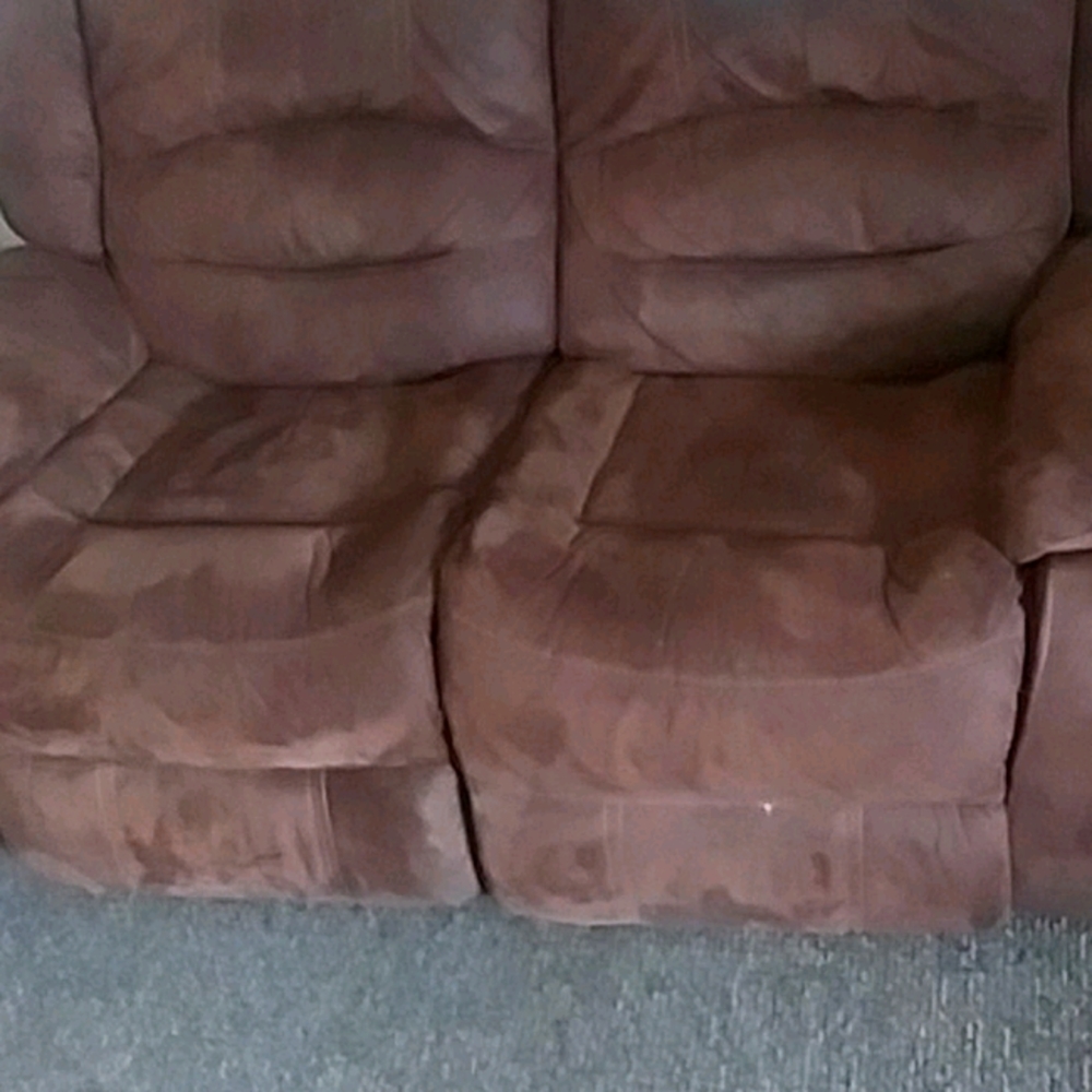 Tan leather electric reclining loveseat.